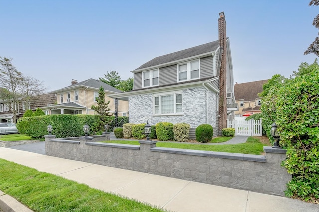 37 Keystone Pl, Hewlett, NY 11557 - view of front of house featuring stone siding and a chimney