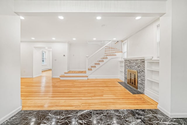 37 Keystone Pl, Hewlett, NY 11557 - unfurnished living room with built in features, stairs, marble finish floors, recessed lighting, and a high end fireplace