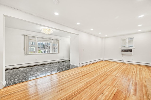 37 Keystone Pl, Hewlett, NY 11557 - empty room with baseboard heating, a baseboard heating unit, hardwood / wood-style flooring, and recessed lighting