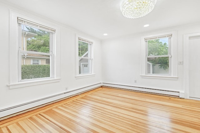 37 Keystone Pl, Hewlett, NY 11557 - empty room with a baseboard heating unit, a chandelier, and recessed lighting