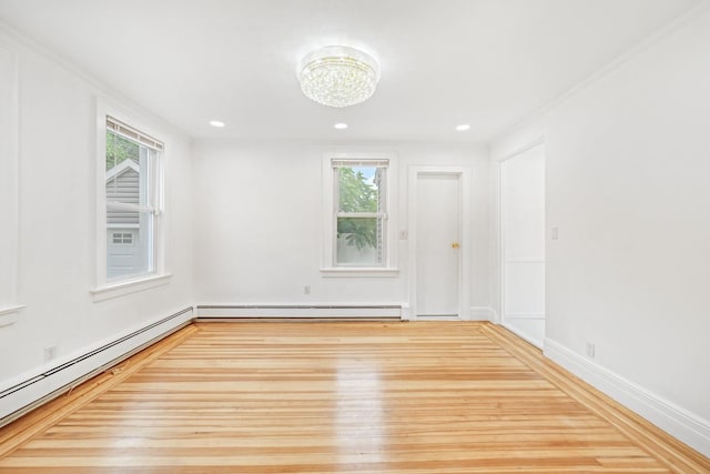 37 Keystone Pl, Hewlett, NY 11557 - unfurnished room with wood finished floors, a baseboard heating unit, plenty of natural light, a chandelier, and recessed lighting