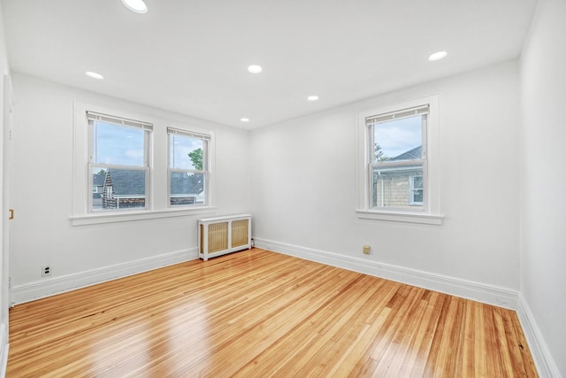 37 Keystone Pl, Hewlett, NY 11557 - spare room with radiator heating unit, wood finished floors, and recessed lighting