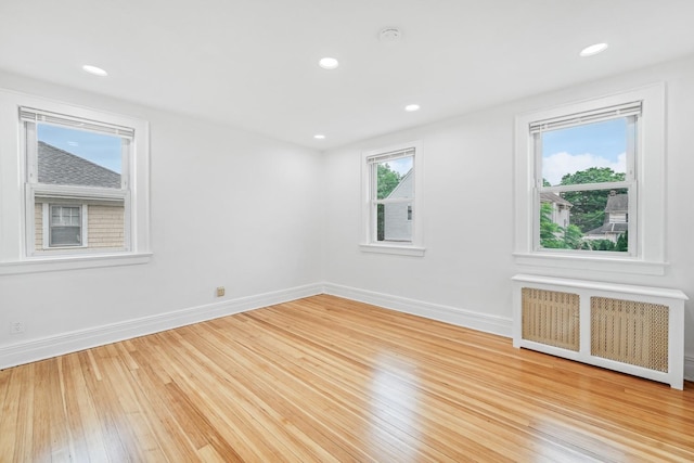 37 Keystone Pl, Hewlett, NY 11557 - empty room featuring radiator, wood finished floors, recessed lighting, and a smoke detector