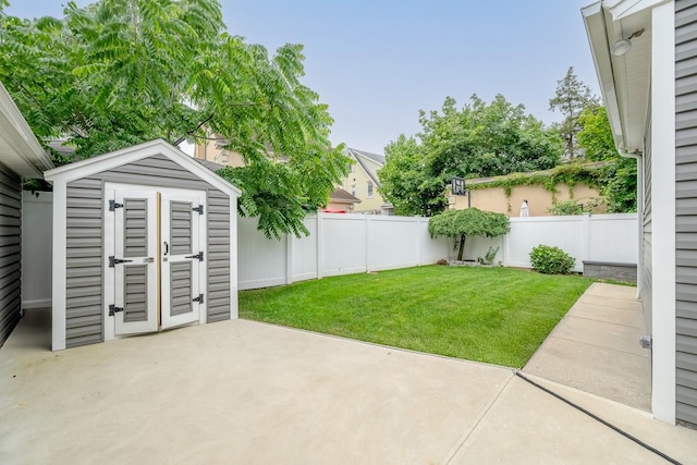 37 Keystone Pl, Hewlett, NY 11557 - fenced backyard featuring a patio and a storage unit