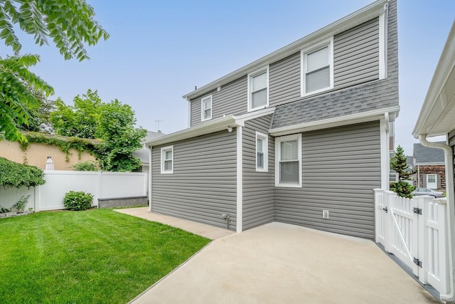 37 Keystone Pl, Hewlett, NY 11557 - back of property featuring a patio area and roof with shingles