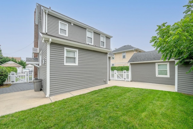37 Keystone Pl, Hewlett, NY 11557 - rear view of house featuring a gate and a patio area
