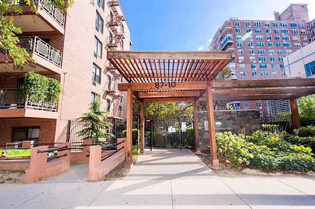 87-10 51st Ave Unit 3E, Elmhurst, NY 11373 - view of property's community featuring a pergola