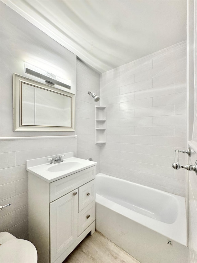 87-10 51st Ave Unit 3E, Elmhurst, NY 11373 - bathroom featuring vanity, shower / bath combination, and tile walls
