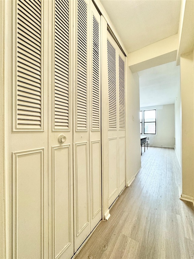 87-10 51st Ave Unit 3E, Elmhurst, NY 11373 - hallway with light wood-style floors