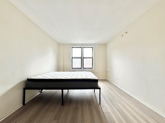 87-10 51st Ave Unit 3E, Elmhurst, NY 11373 - bedroom featuring light wood-style floors and baseboards