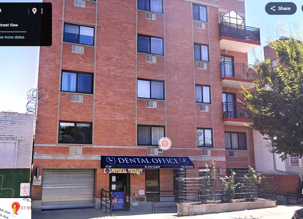 37-59 61st St Unit 5A, Woodside, NY 11377 - view of apartment building / complex with an attached garage