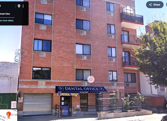 37-59 61st St Unit 5A, Woodside, NY 11377 - view of apartment building / complex with an attached garage
