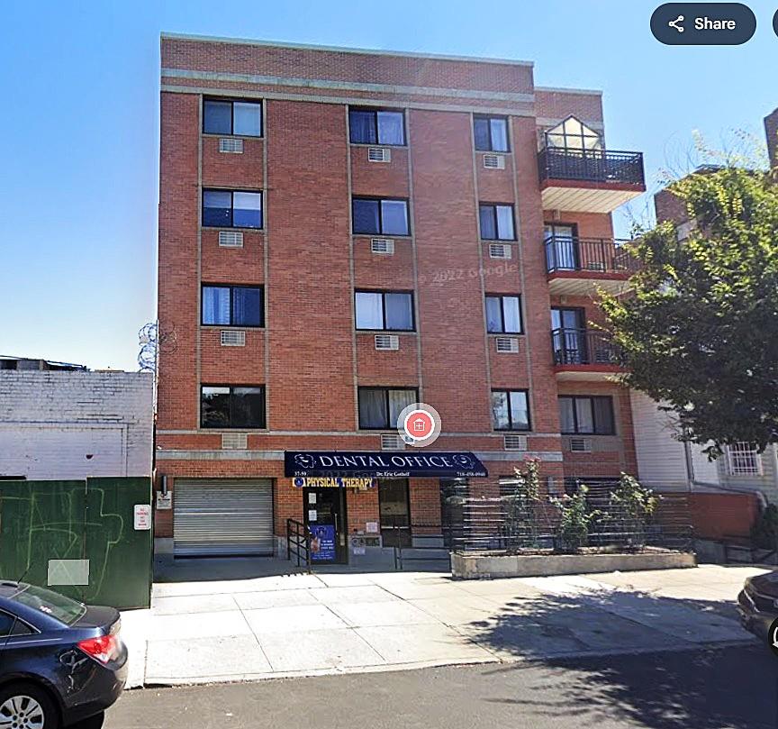 37-59 61st St Unit 5A, Woodside, NY 11377 - view of apartment building / complex featuring an attached garage and driveway