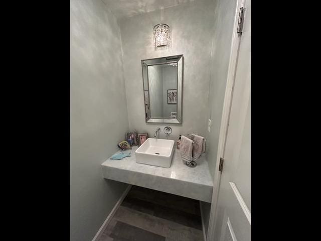 29 Erin Ln Unit 29, East Setauket, NY 11733 - bathroom with a sink and baseboards