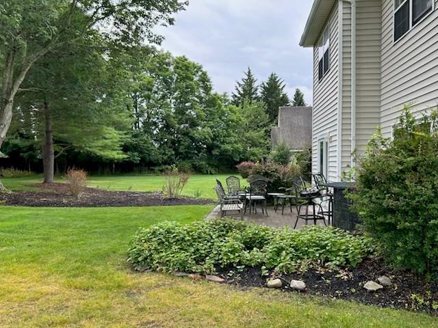 29 Erin Ln Unit 29, East Setauket, NY 11733 - view of grassy yard with a patio area