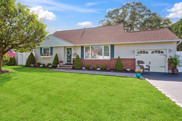 531 Myrtle Ave, West Islip, NY 11795 - view of front of house featuring an attached garage, asphalt driveway, brick siding, and roof with shingles