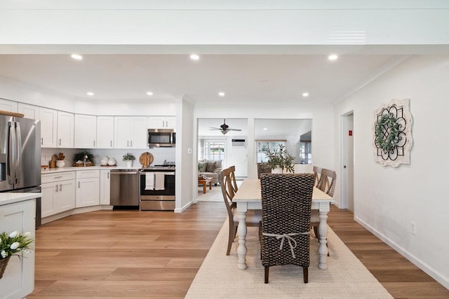 531 Myrtle Ave, West Islip, NY 11795 - dining room featuring crown molding, light wood-style flooring, ceiling fan, and recessed lighting