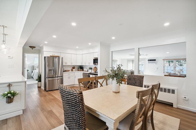 531 Myrtle Ave, West Islip, NY 11795 - dining area with light wood-type flooring, radiator, recessed lighting, and crown molding