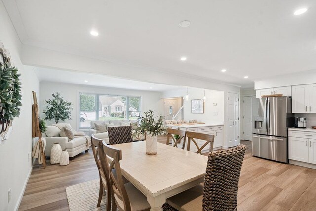 531 Myrtle Ave, West Islip, NY 11795 - dining space featuring light wood finished floors, recessed lighting, and ornamental molding