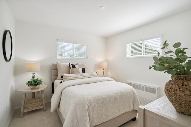 531 Myrtle Ave, West Islip, NY 11795 - bedroom with radiator, multiple windows, and light carpet