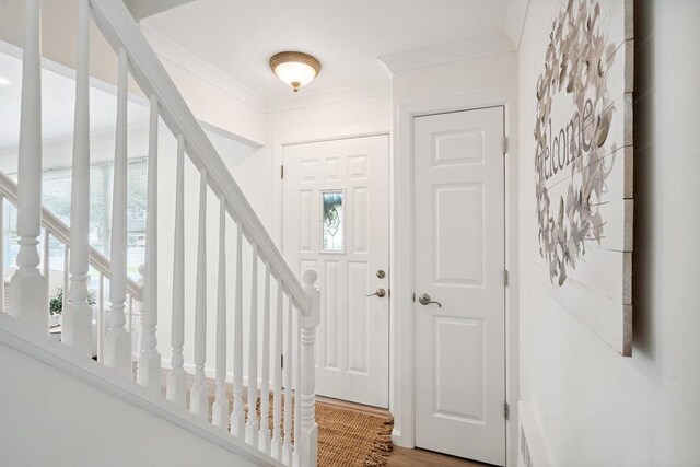 531 Myrtle Ave, West Islip, NY 11795 - foyer entrance with crown molding, stairway, and wood finished floors