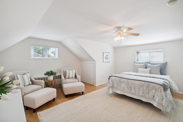 531 Myrtle Ave, West Islip, NY 11795 - bedroom featuring radiator, light wood-type flooring, ceiling fan, and vaulted ceiling