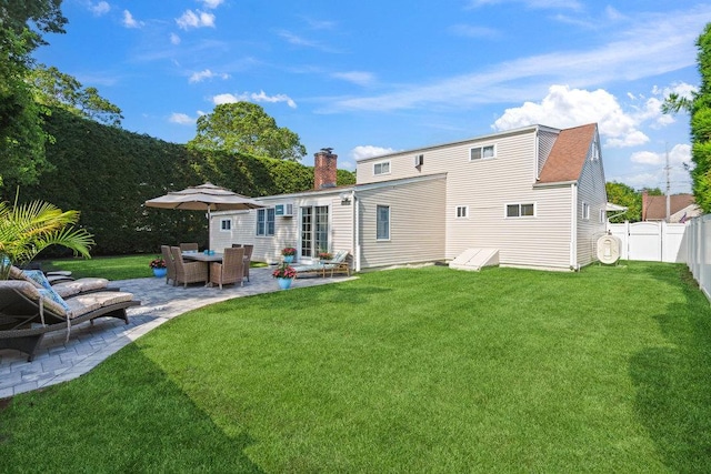 531 Myrtle Ave, West Islip, NY 11795 - rear view of property featuring a patio area, a fenced backyard, and a chimney
