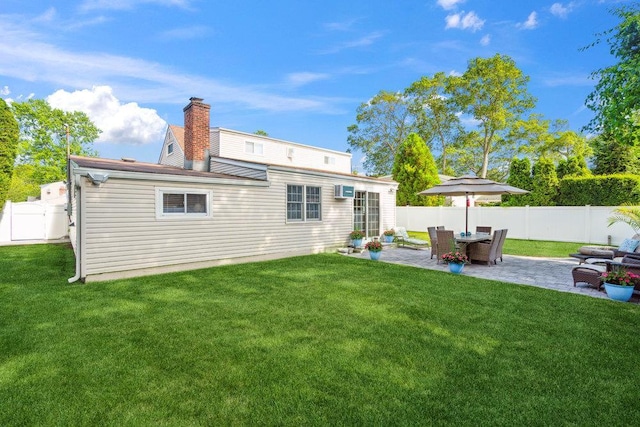 531 Myrtle Ave, West Islip, NY 11795 - rear view of house with a patio, a fenced backyard, and a chimney