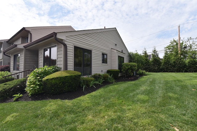 19 Stanford Ct Unit 19, Wantagh, NY 11793 - view of side of property featuring a lawn
