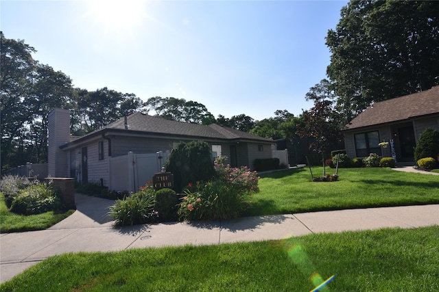 19 Stanford Ct Unit 19, Wantagh, NY 11793 - view of front facade featuring a chimney
