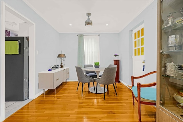 22424 Union Tpke Unit 3C, Oakland Gardens, NY 11364 - dining space featuring light wood-style flooring, crown molding, and recessed lighting