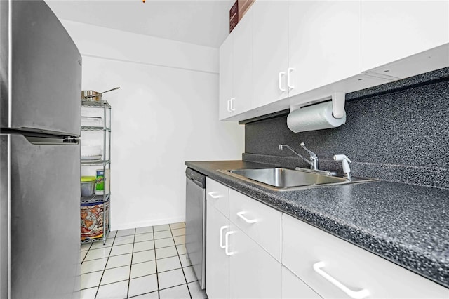 22424 Union Tpke Unit 3C, Oakland Gardens, NY 11364 - kitchen featuring stainless steel appliances, white cabinetry, light tile patterned flooring, and dark countertops