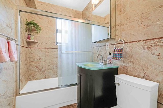 22424 Union Tpke Unit 3C, Oakland Gardens, NY 11364 - bathroom with tile walls, vanity, and shower / bath combination with glass door
