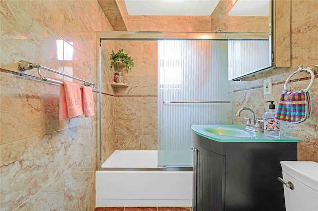 22424 Union Tpke Unit 3C, Oakland Gardens, NY 11364 - bathroom featuring vanity, combined bath / shower with glass door, and tile walls