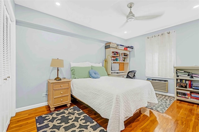22424 Union Tpke Unit 3C, Oakland Gardens, NY 11364 - bedroom featuring wood finished floors, a closet, a wall mounted air conditioner, recessed lighting, and a ceiling fan
