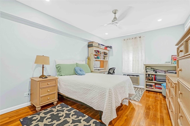 22424 Union Tpke Unit 3C, Oakland Gardens, NY 11364 - bedroom featuring light wood finished floors, a wall unit AC, a ceiling fan, and recessed lighting