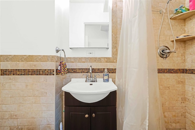 22424 Union Tpke Unit 3C, Oakland Gardens, NY 11364 - bathroom featuring tiled shower, vanity, and tile walls
