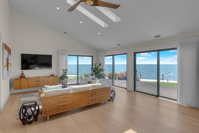 9 Captains Walk E, Bay Shore, NY 11706 - living room featuring a ceiling fan, high vaulted ceiling, light wood-type flooring, recessed lighting, and a skylight