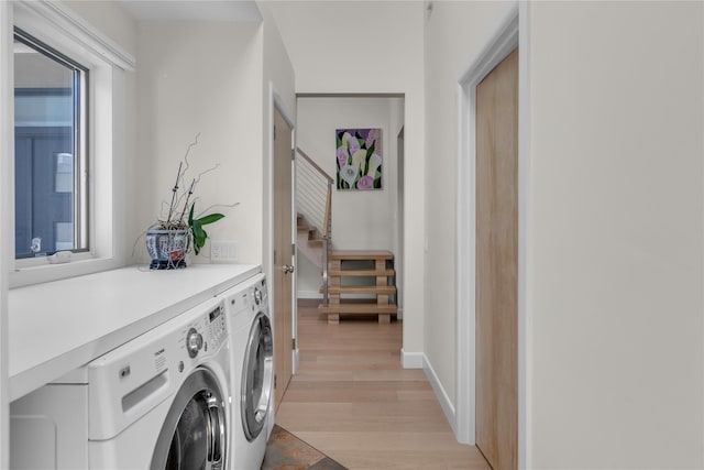 9 Captains Walk E, Bay Shore, NY 11706 - laundry area featuring washer and dryer, light wood-type flooring, and plenty of natural light