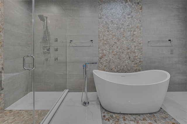 9 Captains Walk E, Bay Shore, NY 11706 - full bathroom featuring a freestanding tub, marble tiled flooring, and a stall shower