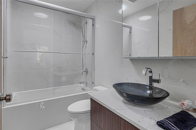 9 Captains Walk E, Bay Shore, NY 11706 - bathroom featuring vanity, bathing tub / shower combination, and tile walls