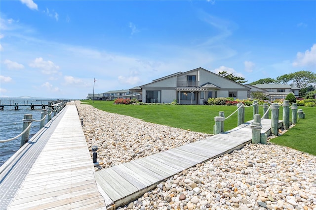 9 Captains Walk E, Bay Shore, NY 11706 - dock area featuring a water view and a yard