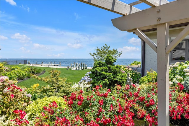 9 Captains Walk E, Bay Shore, NY 11706 - view of green lawn with a water view and a boat dock