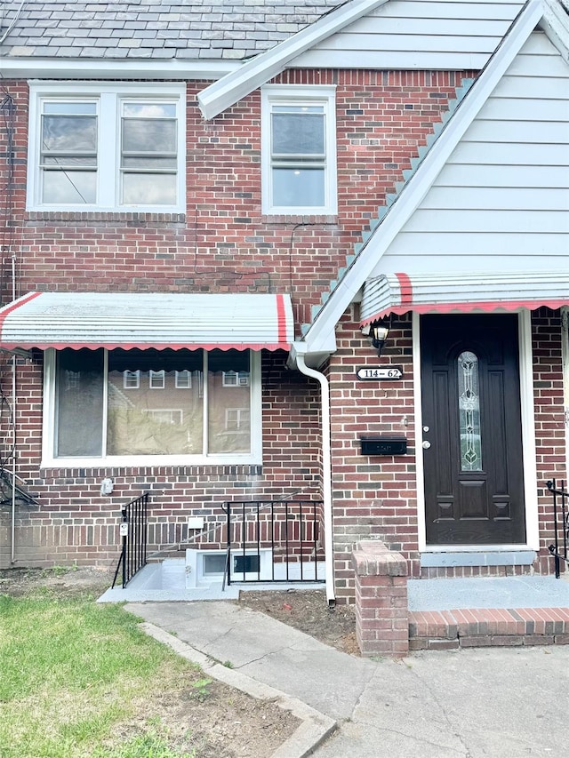 114-62 203rd St, Saint Albans, NY 11412 - entrance to property with brick siding