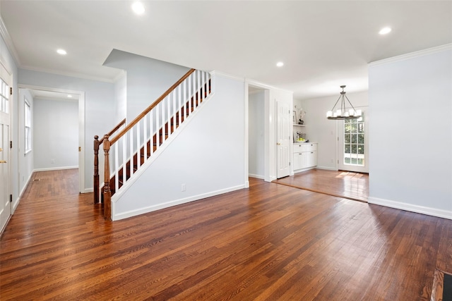 15 Le Britton St, Locust Valley, NY 11560 - entryway with stairway, dark wood finished floors, a chandelier, ornamental molding, and recessed lighting