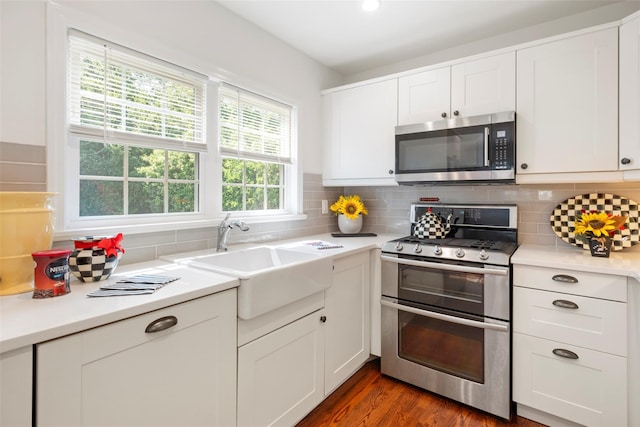 15 Le Britton St, Locust Valley, NY 11560 - kitchen with stainless steel appliances, light countertops, and tasteful backsplash