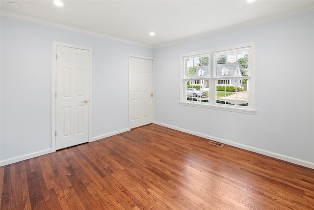 15 Le Britton St, Locust Valley, NY 11560 - unfurnished bedroom featuring wood finished floors, ornamental molding, and recessed lighting