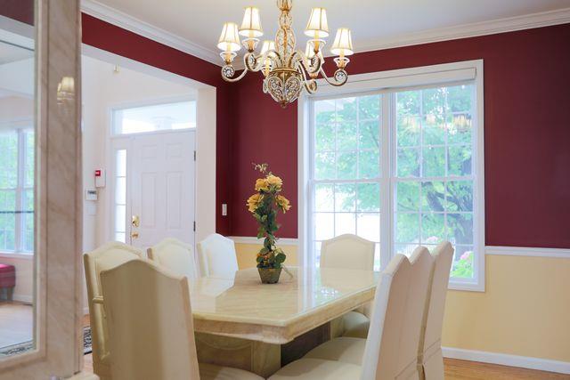 97 Reunion Rd, White Plains, NY 10603 - dining area with a chandelier and crown molding