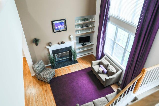 97 Reunion Rd, White Plains, NY 10603 - living area featuring wood finished floors and a fireplace with flush hearth