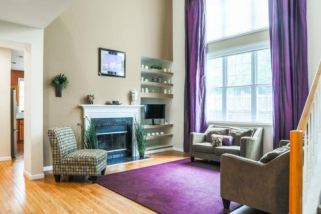 97 Reunion Rd, White Plains, NY 10603 - living room featuring wood finished floors and a fireplace with flush hearth